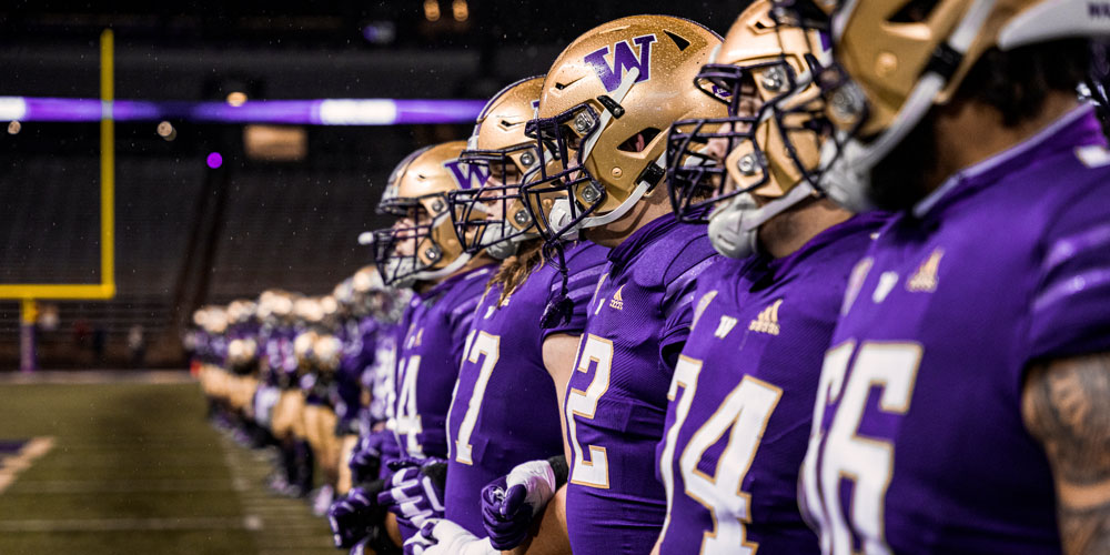 Football team joining arms