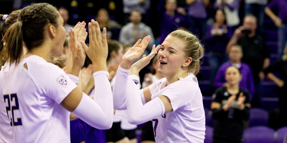 Ella May Powell high-fives teammates