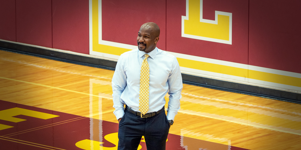 Kai Bynum stands on Lakeside School's basketball court