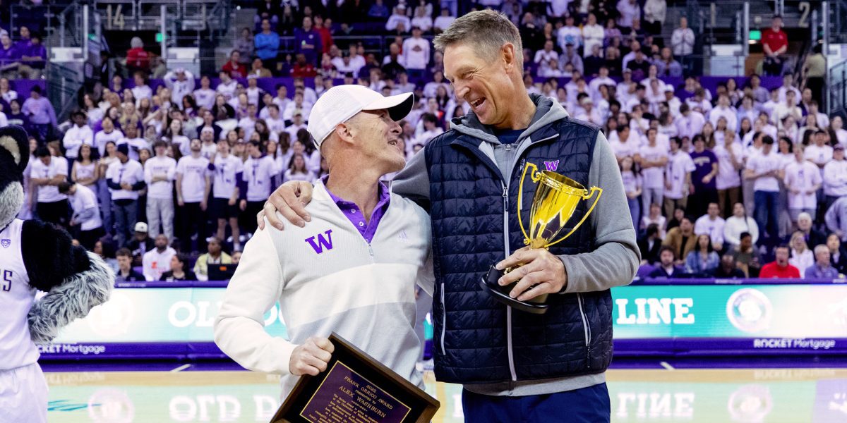 Detlef Schrempf and Alex Washburn are presented with their awards at a Husky Men's Basketball game