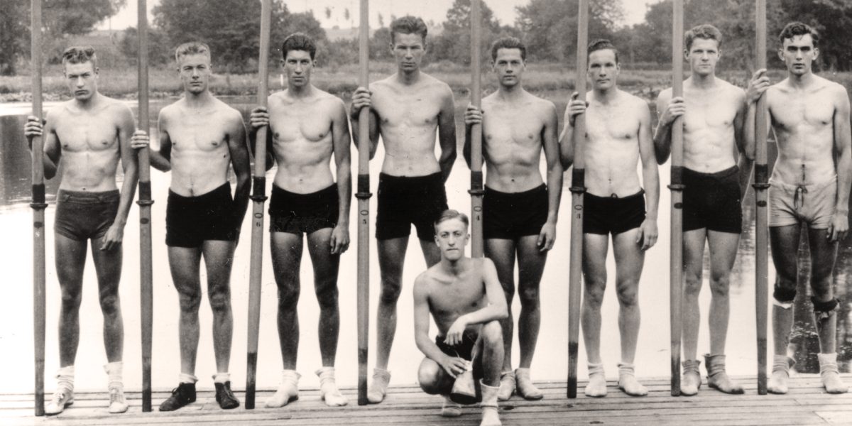 The Boys in the Boat - 1936 UW Men's Rowing team poses with oars