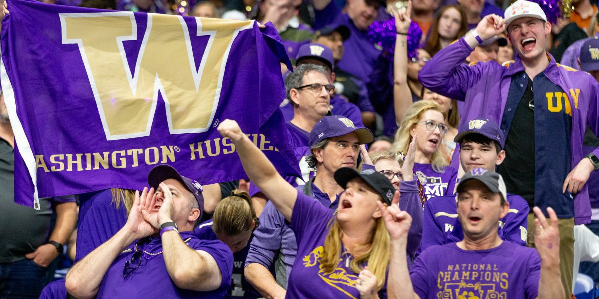 Fans cheering at the Alamo Bowl
