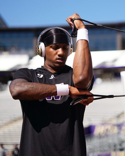 Michael Penix Jr. using resistance bands