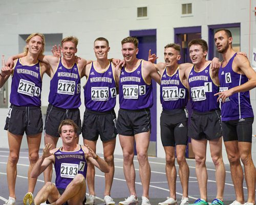 Sub four-minute mile runners pose in Dempsey indoor