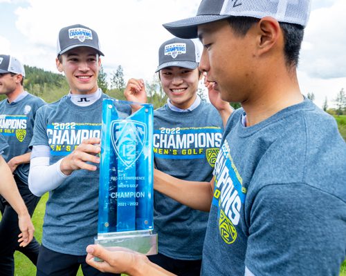 Teddy Lin holds Pac-12 Championship trophy