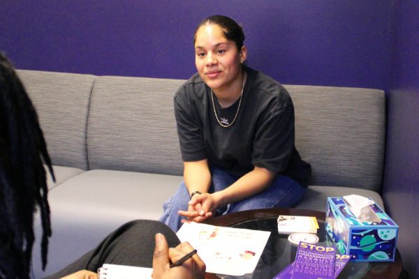 Female student-athlete meets with a member of the mental health team