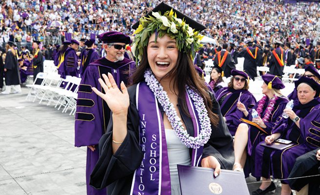 Gymnast Taylor Russon in cap and gown holding a diploma