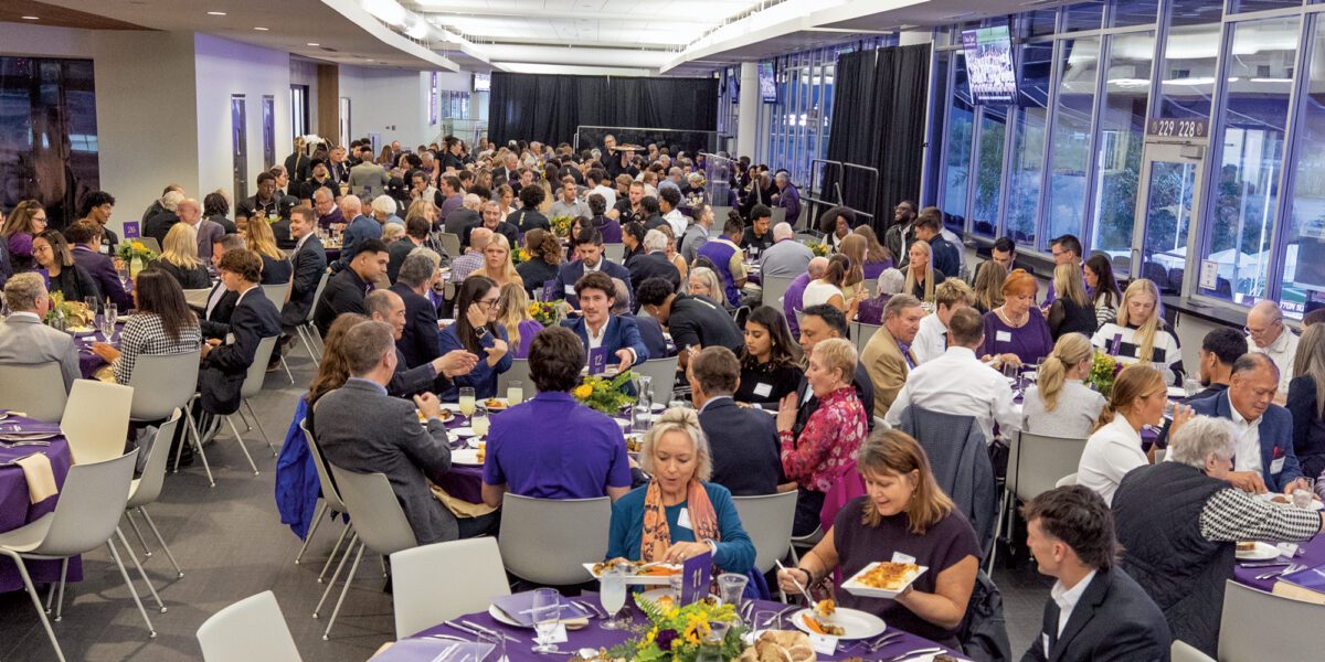 Student-athletes and endowment donors talk and share a meal in the Don James Center