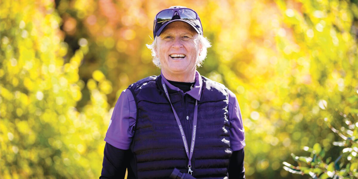 Women's Golf Head Coach Mary Lou Mulflur smiles in fall landscape