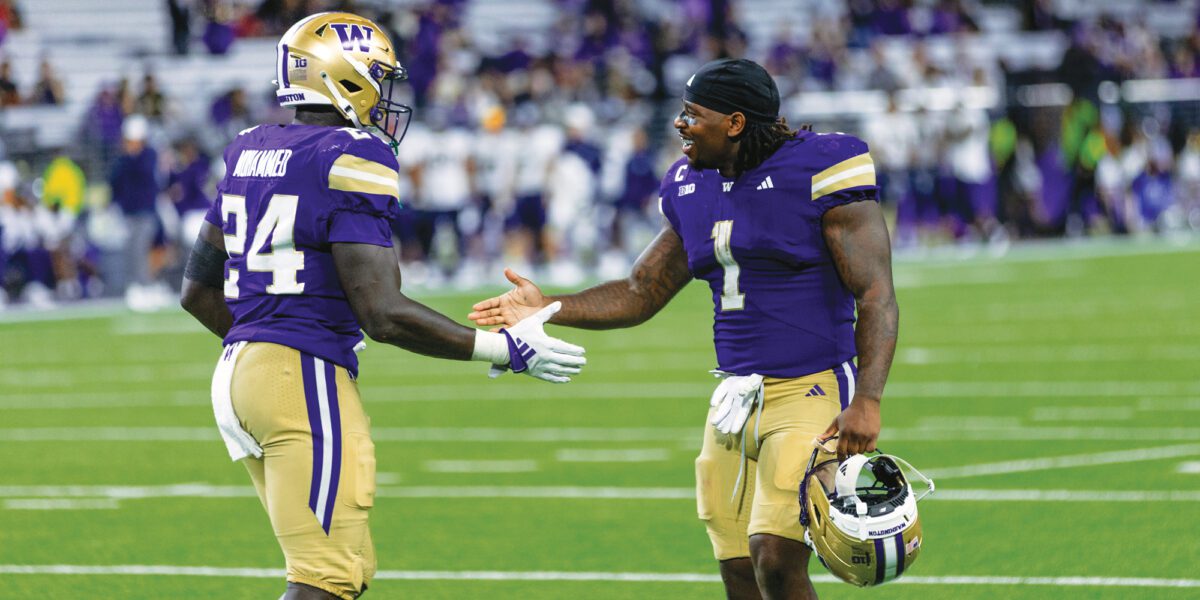 Jonah Coleman high-fives teammate, Adam Mohammed