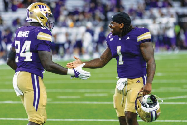 Jonah Coleman high-fives teammate, Adam Mohammed