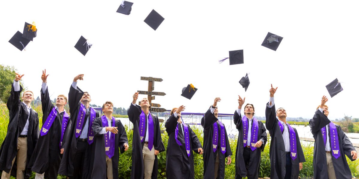 Men's rowers throw graduation caps in sky