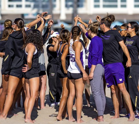 Beach Volleyball team huddle
