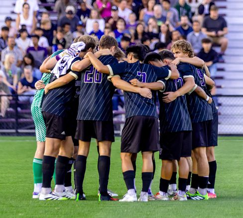 Men's Soccer team huddle