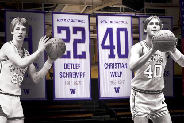Cutout photos of Detlef and Christian over their UW jerseys hanging in the rafters of Alaska Airlines Arena