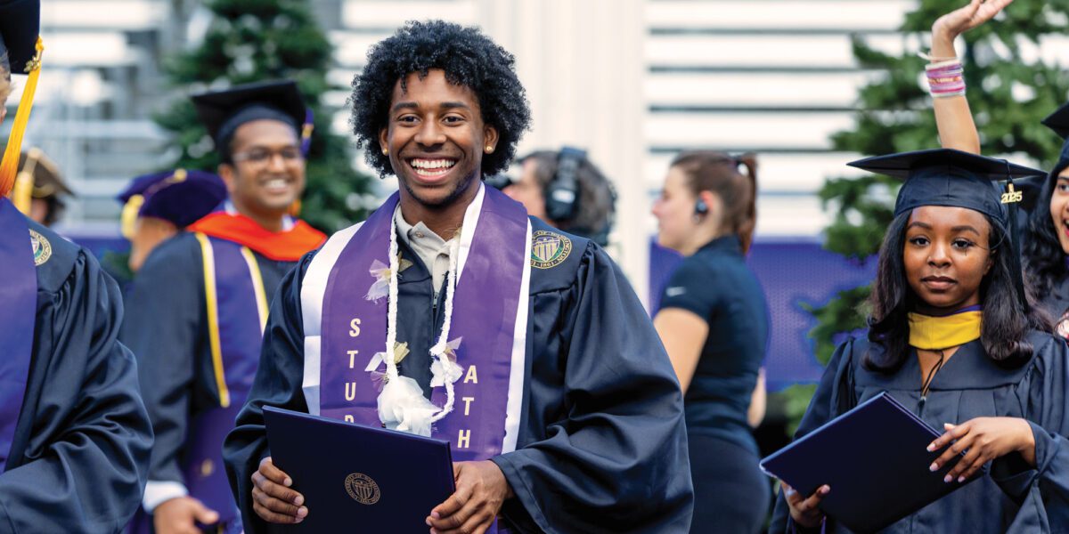 Track & Field's Prestin Artis collects diploma at 2025 UW Commencement