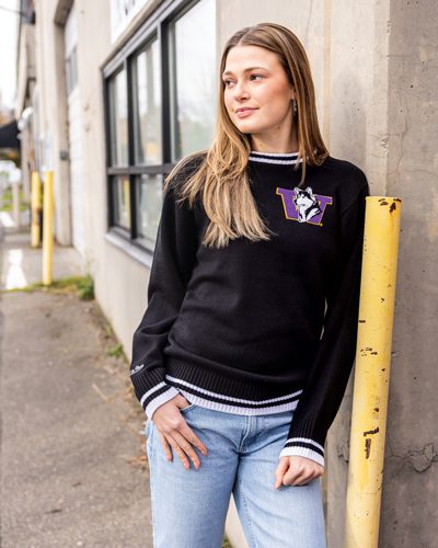 Alexa Markley poses in a UW branded Simply Seattle sweatshirt