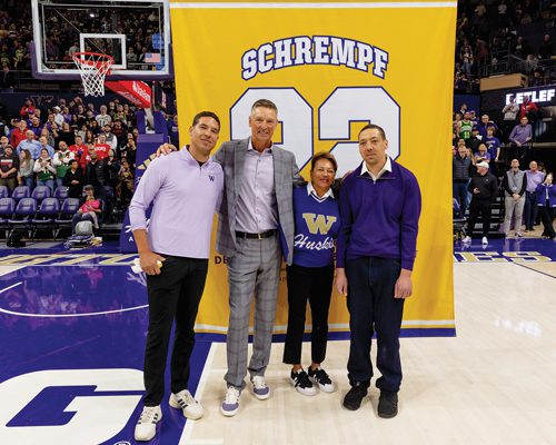 Detlef poses with family during jersey retirement ceremony